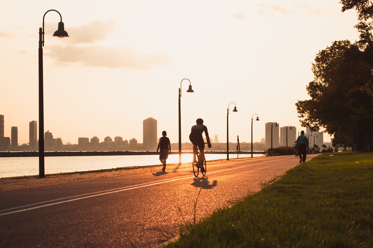 A cyclist in Toronto as the sun sets