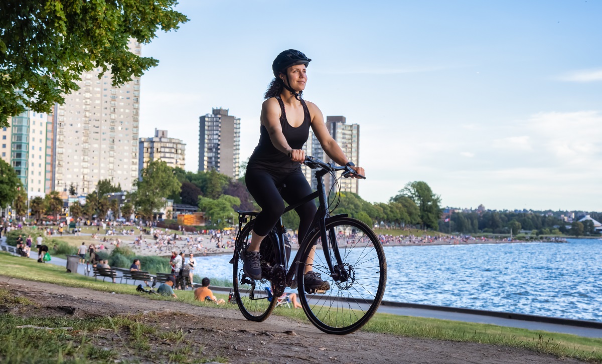 Woman riding a bike in Stanley Park