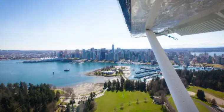 Seaplane over Coal Harbour - Patrick Kuschfeld - Harbour Air Seaplanes