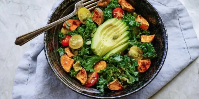 Kale, roasted yams and avocado salad