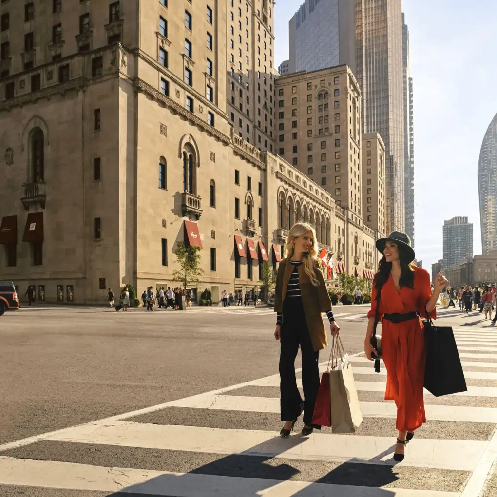 Two woman walk across a zebra crossing in Toronto