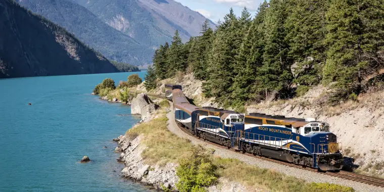 The Rocky Mountaineer train winding along the shores of Seton Lake