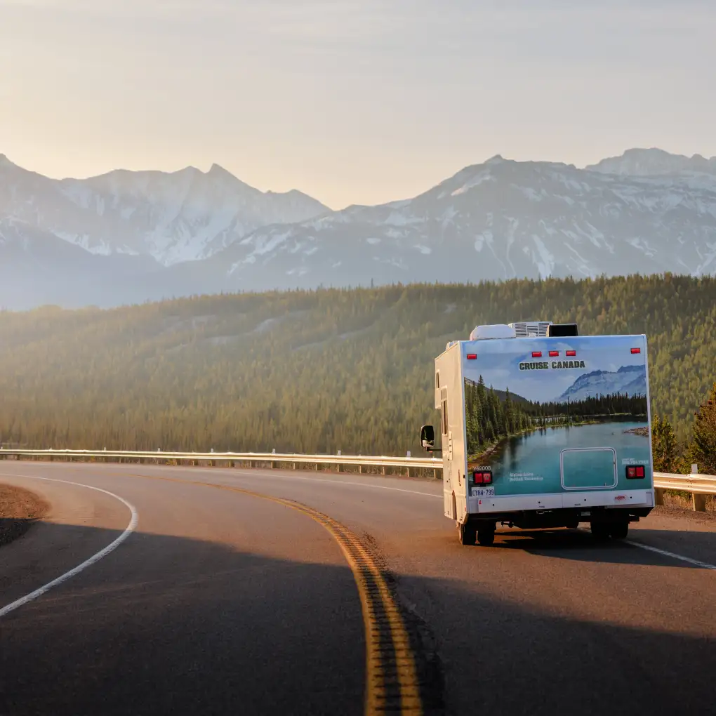a motorhome drives along a scenic highway in Canada