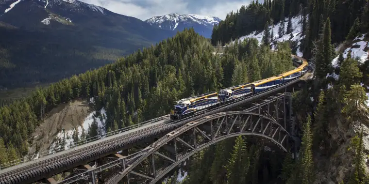 The Rocky Mountaineer train crossing the Stoney Creek Bridge in Glacier National Park, BC