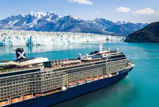Celebrity Cruise ship sails near a glacier