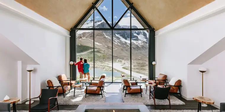 A couple admiring the views from the lounge at Glacier View Lodge